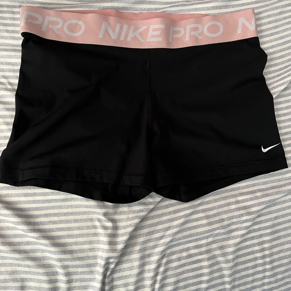 Nike pros with pink band